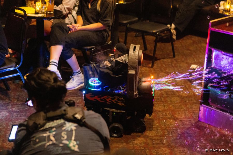 The coffin car throwing sparks in the street