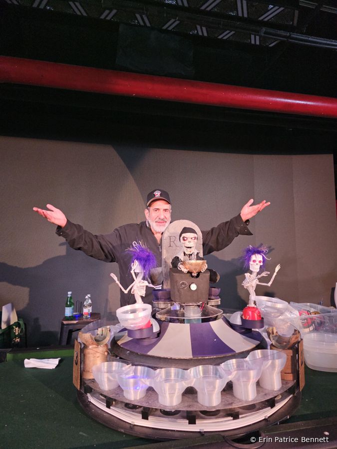 Arms wide at the Deadman game table